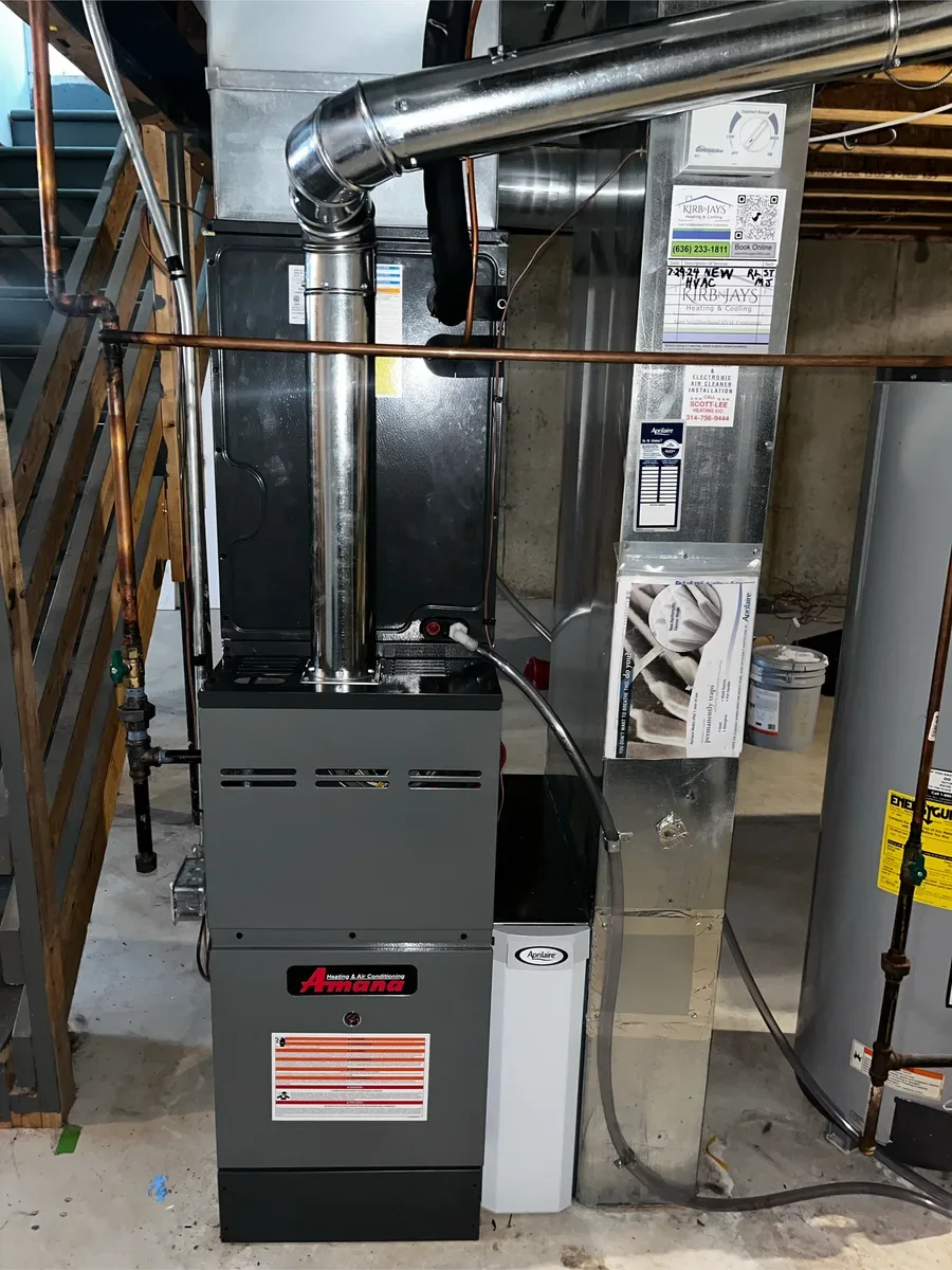 Completed furnace replacement beside the same water heater and ductwork in Lake St. Louis.