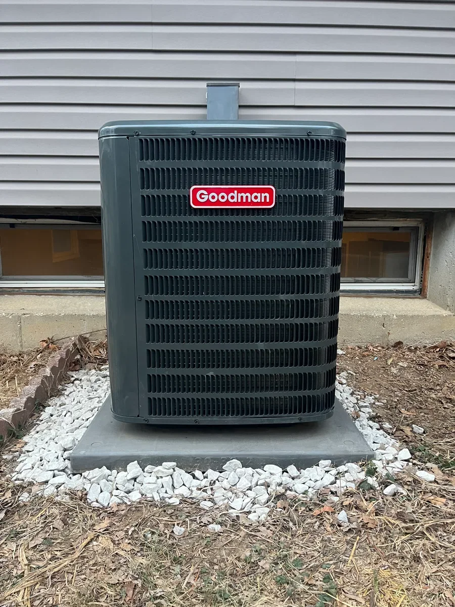 Completed outdoor air conditioner replacement in a St. Charles side yard.