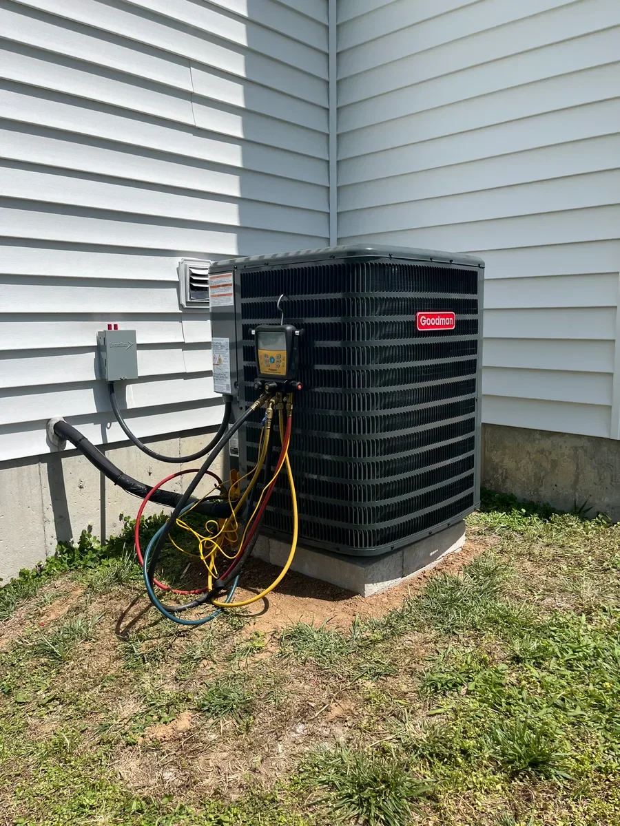 Completed outdoor air conditioner replacement in the same Wentzville side yard.